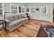 Comfortable living room with a neutral color palette, multiple windows, and hardwood floors, offering a relaxing space at 1788 Club Circle, Pawleys Island, SC 29585
