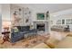 Comfortable living room with a gray brick fireplace, plush seating, and stylish decor at 1788 Club Circle, Pawleys Island, SC 29585