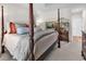 Comfortable main bedroom featuring a four poster bed and stylish decorative details at 1788 Club Circle, Pawleys Island, SC 29585