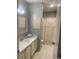 Well-lit bathroom featuring a single sink vanity with a large mirror and a shower-tub combination at 18 Canvas Back Cove # 122, Georgetown, SC 29440