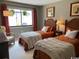 Comfortable bedroom featuring two twin beds, light colored walls and natural light from the window at 18 Canvas Back Cove # 122, Georgetown, SC 29440
