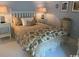 Comfortable bedroom featuring a bed with cozy patterned bedding and soft lighting from bedside lamps at 18 Canvas Back Cove # 122, Georgetown, SC 29440