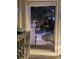 Welcoming entryway featuring view of walkway and cabinet with unique design at 18 Canvas Back Cove # 122, Georgetown, SC 29440