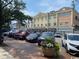 Street view of building with parking and flower planters, featuring shops at Fogel Wharf at 18 Canvas Back Cove # 122, Georgetown, SC 29440