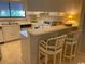 Efficient kitchen featuring bright counter tops and casual bar seating at 18 Canvas Back Cove # 122, Georgetown, SC 29440
