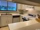 Kitchen with white cabinets, lots of counter space, and views from the window at 18 Canvas Back Cove # 122, Georgetown, SC 29440