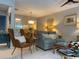 Open living space with comfortable seating, stylish decor, and views into the dining area at 18 Canvas Back Cove # 122, Georgetown, SC 29440
