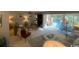 Open-concept living room with a fireplace, comfortable seating, and sliding doors for natural light at 18 Canvas Back Cove # 122, Georgetown, SC 29440