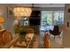 Bright, combined living and dining area with views of the outdoor scenery at 18 Canvas Back Cove # 122, Georgetown, SC 29440