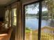 Beautiful water views from the sliding door, showing the lake, bridge, and lush greenery at 18 Canvas Back Cove # 122, Georgetown, SC 29440