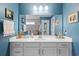 This modern bathroom features a large mirror, white vanity, and contemporary lighting at 1838 Zodiac Court, Myrtle Beach, SC 29577