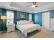 Bright bedroom featuring teal walls, white trim, and plush carpeting for ultimate comfort at 1838 Zodiac Court, Myrtle Beach, SC 29577