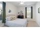 Comfortable bedroom with neutral colors, a ceiling fan, and a window with views of the outdoors at 1838 Zodiac Court, Myrtle Beach, SC 29577