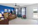 Bedroom featuring a blue accent wall, toys, and a sliding glass door to the outdoors at 1838 Zodiac Court, Myrtle Beach, SC 29577