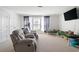 Bonus room with neutral carpet, recliner seating, and plenty of natural light at 1838 Zodiac Court, Myrtle Beach, SC 29577