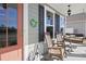 Inviting front porch with rocking chairs, a swing, and cheerful decorations creating a cozy outdoor space at 1838 Zodiac Court, Myrtle Beach, SC 29577