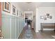 Inviting hallway with wainscoting and wood floors leading into a spacious living area at 1838 Zodiac Court, Myrtle Beach, SC 29577