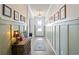Bright and inviting hallway features elegant wainscoting, wood floors, and tasteful decor at 1838 Zodiac Court, Myrtle Beach, SC 29577