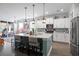 Well-lit kitchen offers a large island with seating, stainless appliances, and plenty of cabinet space at 1838 Zodiac Court, Myrtle Beach, SC 29577