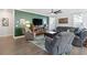 Cozy living room with comfortable seating, a large television, and a ceiling fan at 1838 Zodiac Court, Myrtle Beach, SC 29577