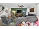 Spacious living room featuring comfortable seating, modern decor, and a large wall-mounted television at 1838 Zodiac Court, Myrtle Beach, SC 29577