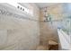 The neutral-tiled walk-in shower features a showerhead and bench seating at 1838 Zodiac Court, Myrtle Beach, SC 29577