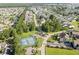 Panoramic aerial view highlighting tennis courts, lush greenery, and inviting homes in the community at 1931 Bent Grass Dr. # H, Surfside Beach, SC 29575