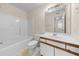 Bathroom featuring single sink vanity, tub/shower combo, and neutral color palette at 1931 Bent Grass Dr. # H, Surfside Beach, SC 29575