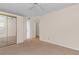 Neutral bedroom with closet, fan and access to other rooms at 1931 Bent Grass Dr. # H, Surfside Beach, SC 29575