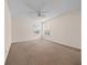 Bedroom with neutral walls and a fan, creating a serene space at 1931 Bent Grass Dr. # H, Surfside Beach, SC 29575