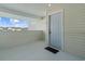 A welcoming condo entrance featuring a covered porch, a light-blue door, and a 'Welcome' sign at 1931 Bent Grass Dr. # H, Surfside Beach, SC 29575