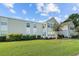 Exterior of condo building featuring manicured lawn and well-maintained siding, providing a welcoming curb appeal at 1931 Bent Grass Dr. # H, Surfside Beach, SC 29575