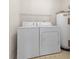 Laundry area with washer, dryer and shelving at 1931 Bent Grass Dr. # H, Surfside Beach, SC 29575