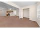 Open-concept living area with views into the kitchen and closet space at 1931 Bent Grass Dr. # H, Surfside Beach, SC 29575