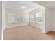 Spacious living room with multiple windows offering natural light at 1931 Bent Grass Dr. # H, Surfside Beach, SC 29575