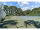 Tennis courts surrounded by a chain link fence and plenty of trees for privacy at 1931 Bent Grass Dr. # H, Surfside Beach, SC 29575