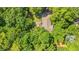 Aerial perspective displays the home nestled amongst lush greenery, demonstrating privacy and natural surroundings at 196 Weston Rd., Pawleys Island, SC 29585