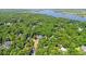 Aerial shot of the community surrounded by trees and a glimpse of the wide river at 196 Weston Rd., Pawleys Island, SC 29585