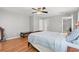 Well-lit bedroom with a comfortable bed, hardwood floors, and two doors for convenience at 196 Weston Rd., Pawleys Island, SC 29585