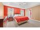 Bedroom with bright red walls, neutral carpet, and large window for natural lighting at 196 Weston Rd., Pawleys Island, SC 29585