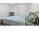 Bedroom with hardwood floors, comfortable bed, and a large window letting in natural light at 196 Weston Rd., Pawleys Island, SC 29585