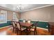 Traditional dining room with a large table, six chairs, and classic chandelier lighting fixture at 196 Weston Rd., Pawleys Island, SC 29585