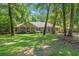Ranch style home with shaded front yard and manicured lawn at 196 Weston Rd., Pawleys Island, SC 29585