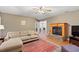 Inviting living room with hardwood floors, fireplace, and comfortable seating area with natural light at 196 Weston Rd., Pawleys Island, SC 29585