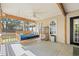 Comfortable outdoor porch with a daybed swing and ceiling fan for relaxation at 196 Weston Rd., Pawleys Island, SC 29585