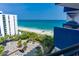 Balcony with views of the beach, ocean, and palm trees at 2001 S Ocean Blvd. S # 1013, Myrtle Beach, SC 29577