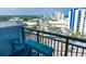 Balcony with seating and views of city streets, parking, and distant cityscape at 2001 S Ocean Blvd. S # 1013, Myrtle Beach, SC 29577