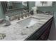 Bathroom vanity with marble countertop and stainless steel faucet at 2001 S Ocean Blvd. S # 1013, Myrtle Beach, SC 29577