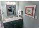 Bathroom with marble countertop and decorative mirror at 2001 S Ocean Blvd. S # 1013, Myrtle Beach, SC 29577