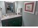Bathroom with marble countertop and decorative mirror at 2001 S Ocean Blvd. S # 1013, Myrtle Beach, SC 29577